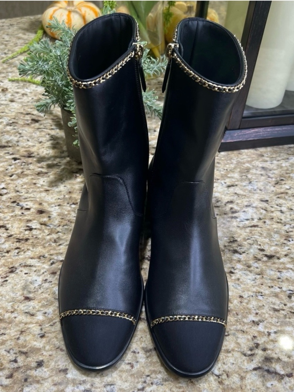 CHANEL Black Ankle Boots with Gold Accents